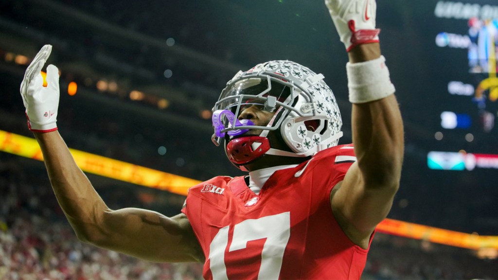 Ohio State Buckeyes wide receiver Carnell Tate (17) celebrates a touchdown Saturday, Dec. 6, 2025, during the Big Ten football championship against the Indiana Hoosiers at Lucas Oil Stadium in Indianapolis.