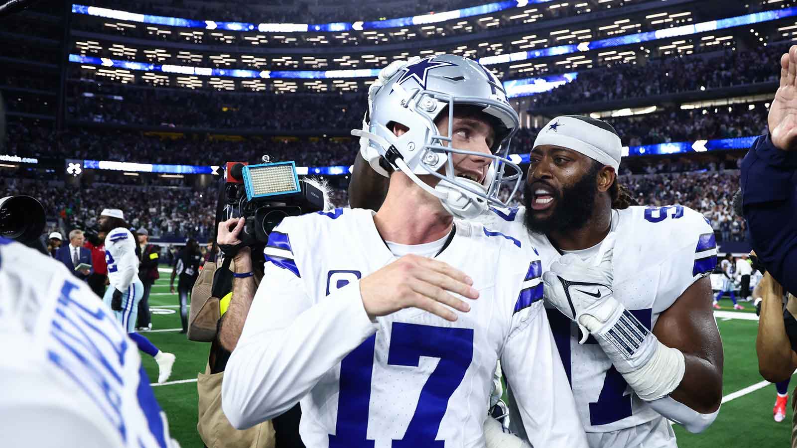 Dallas Cowboys defensive tackle Osa Odighizuwa (97) congratulates kicker Brandon Aubrey (17) after the game against the Philadelphia Eagles at AT&T Stadium.