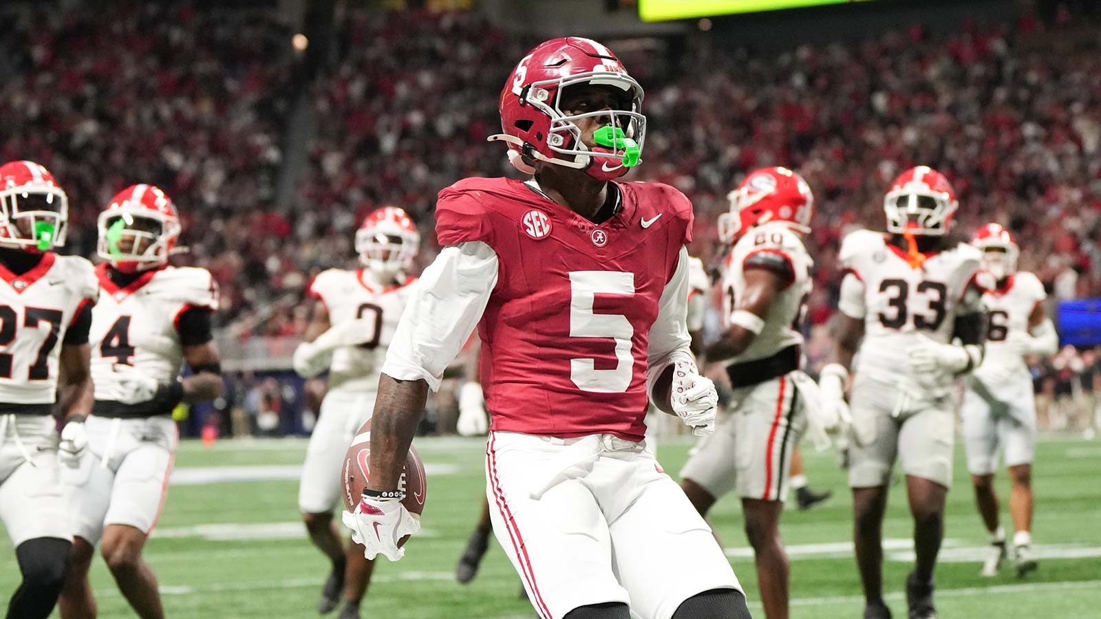 Alabama Crimson Tide wide receiver Germie Bernard (5) scores a touchdown during the fourth quarter against the Georgia Bulldogs during the 2025 SEC Championship game at Mercedes-Benz Stadium.