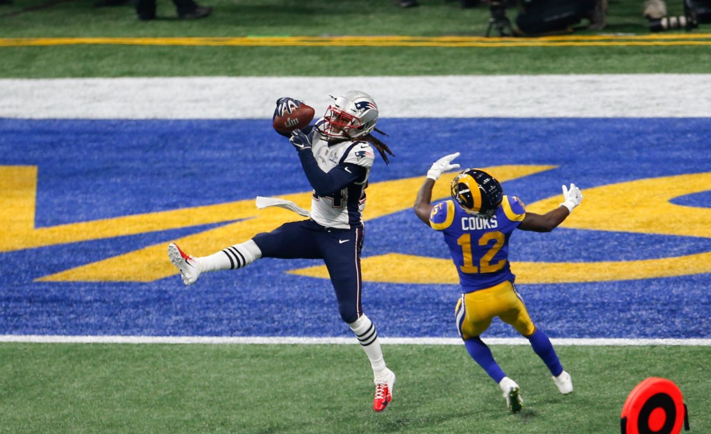 Stephon Gilmore #24 of the New England Patriots intercepts a pass against the Los Angeles Rams during Super Bowl LIII at Mercedes-Benz Stadium on February 03, 2019 in Atlanta, Georgia.