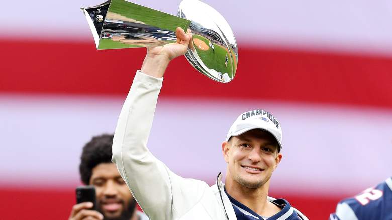 Rob Gronkowski holds the Lombardi Trophy at Fenway Park before a Red Sox game in Boston