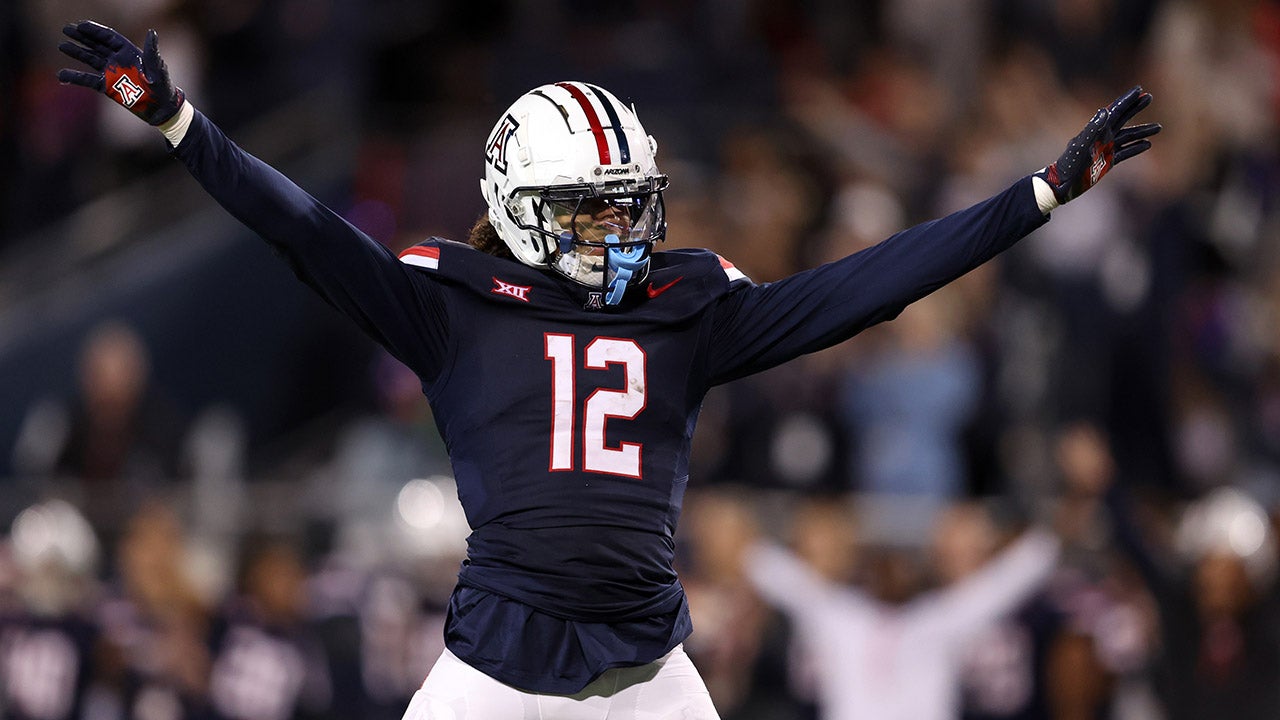 TUCSON, ARIZONA - NOVEMBER 15: Defensive back Genesis Smith #12 of the Arizona Wildcats celebrates after a defensive stop during the second half against the Houston Cougars at Arizona Stadium on November 15, 2024 in Tucson, Arizona. (Photo by Chris Coduto/Getty Images)