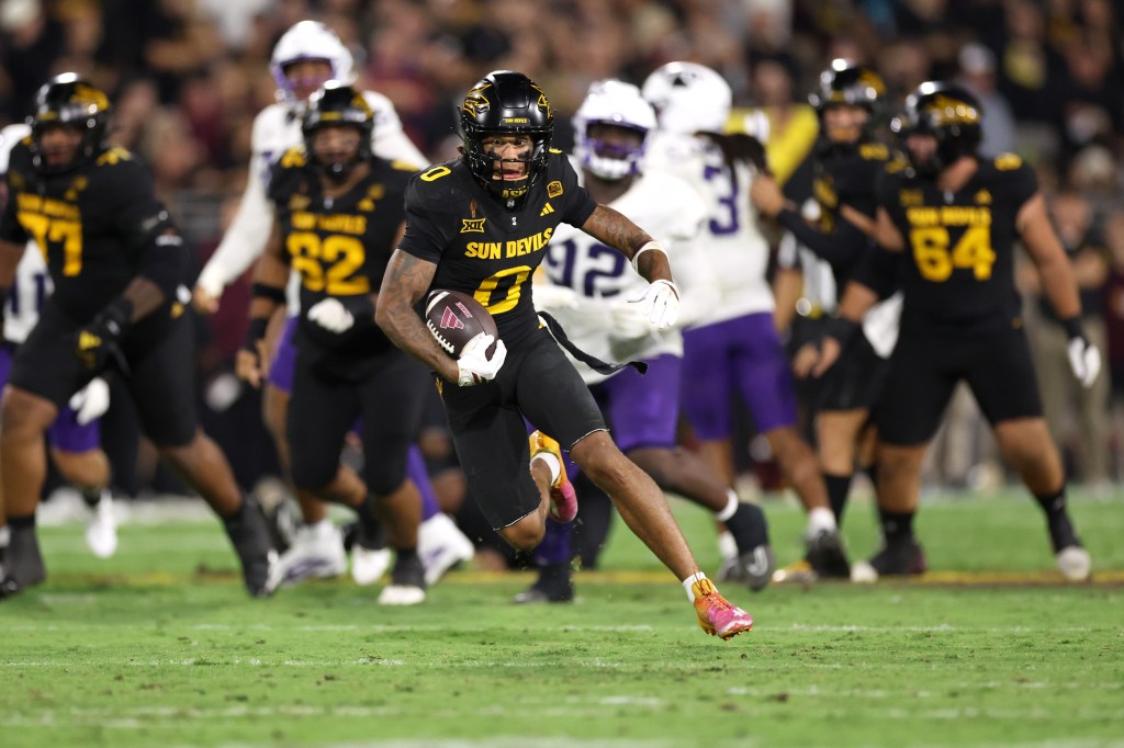Wide receiver Jordyn Tyson #0 of the Arizona State Sun Devils runs after a reception against the TCU Horned Frogs 