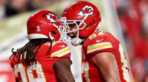 Kareem Hunt and Travis Kelce celebrate as Chiefs beat Commanders in Week 8.
