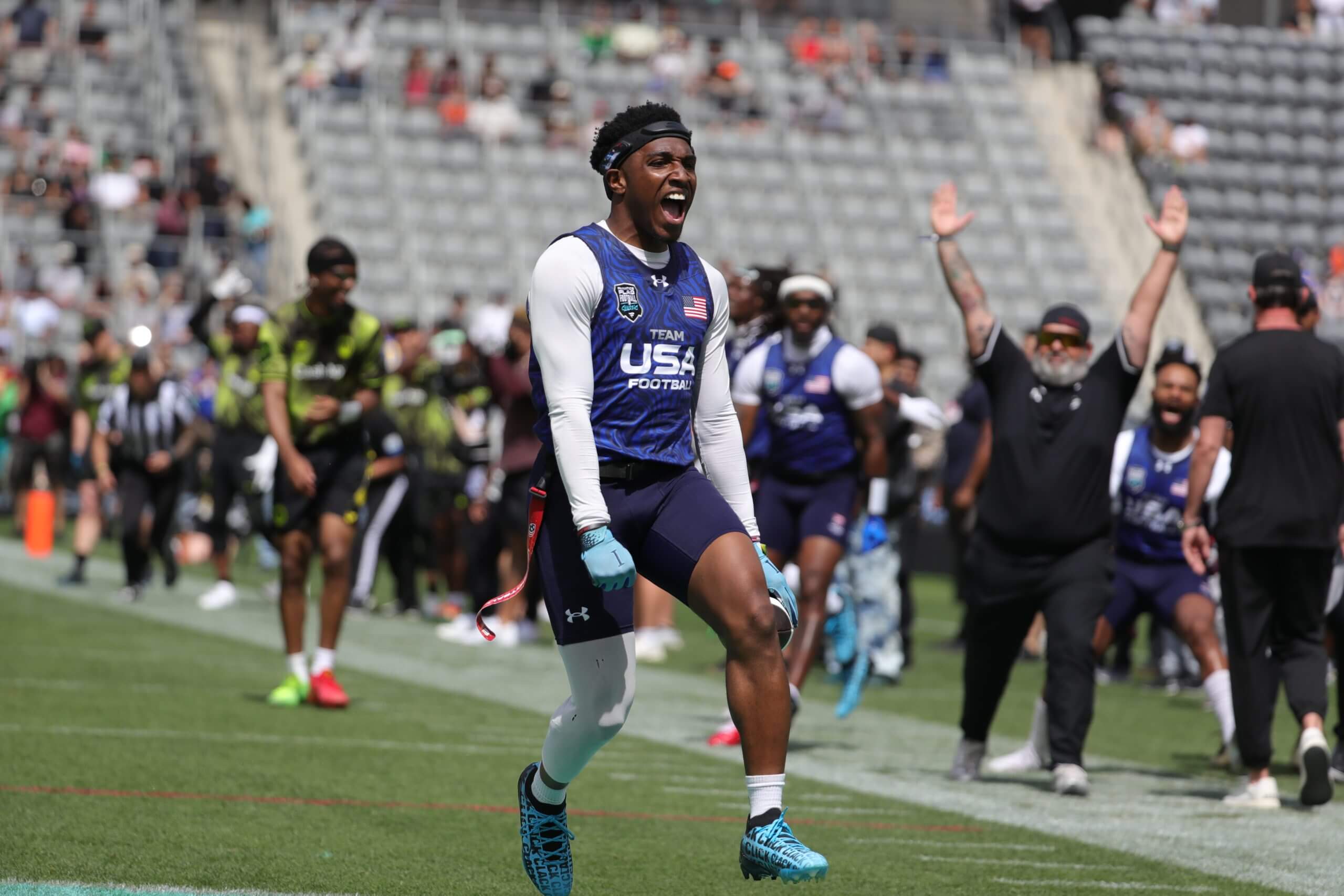 Team USA's Isaiah Calhoun (11) celebrates after picking off Joe Burrow during the Fanatics Flag Football Classic.