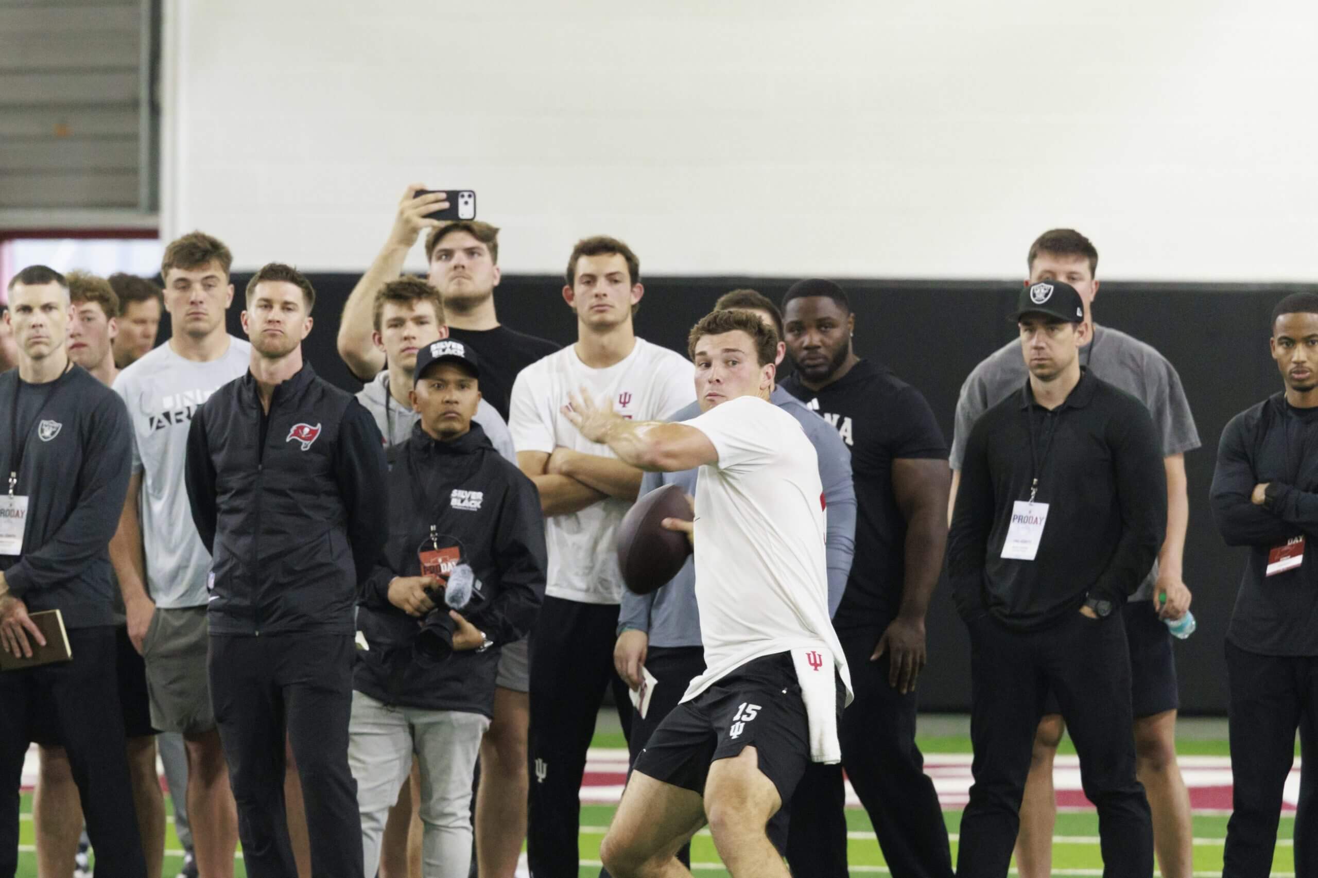 Indiana Hoosiers quarterback Fernando Mendoza throws a pass in front of NFL personnel and others during the school's pro day.