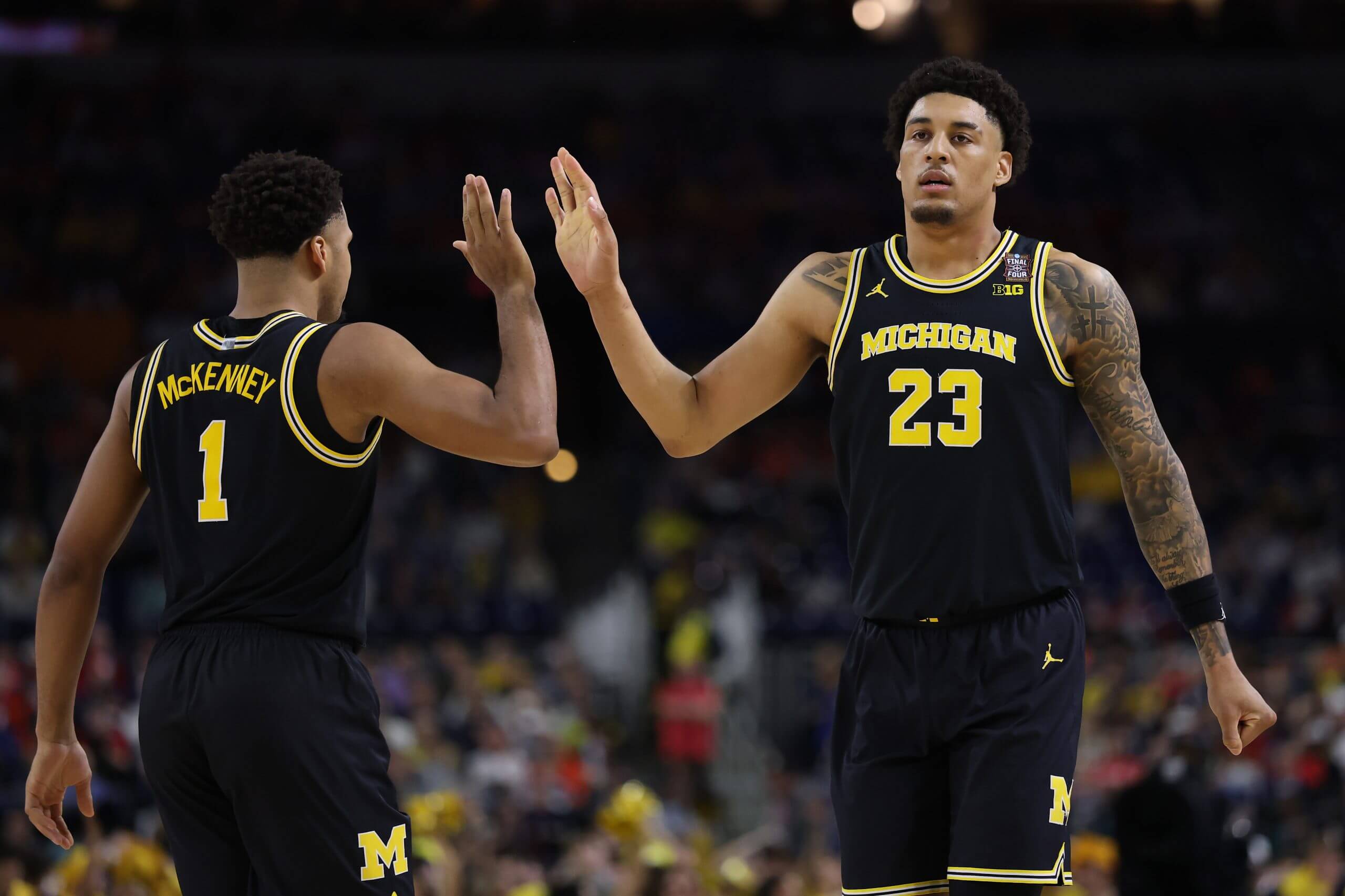 Yaxel Lendeborg high-fives Trey McKenney.
