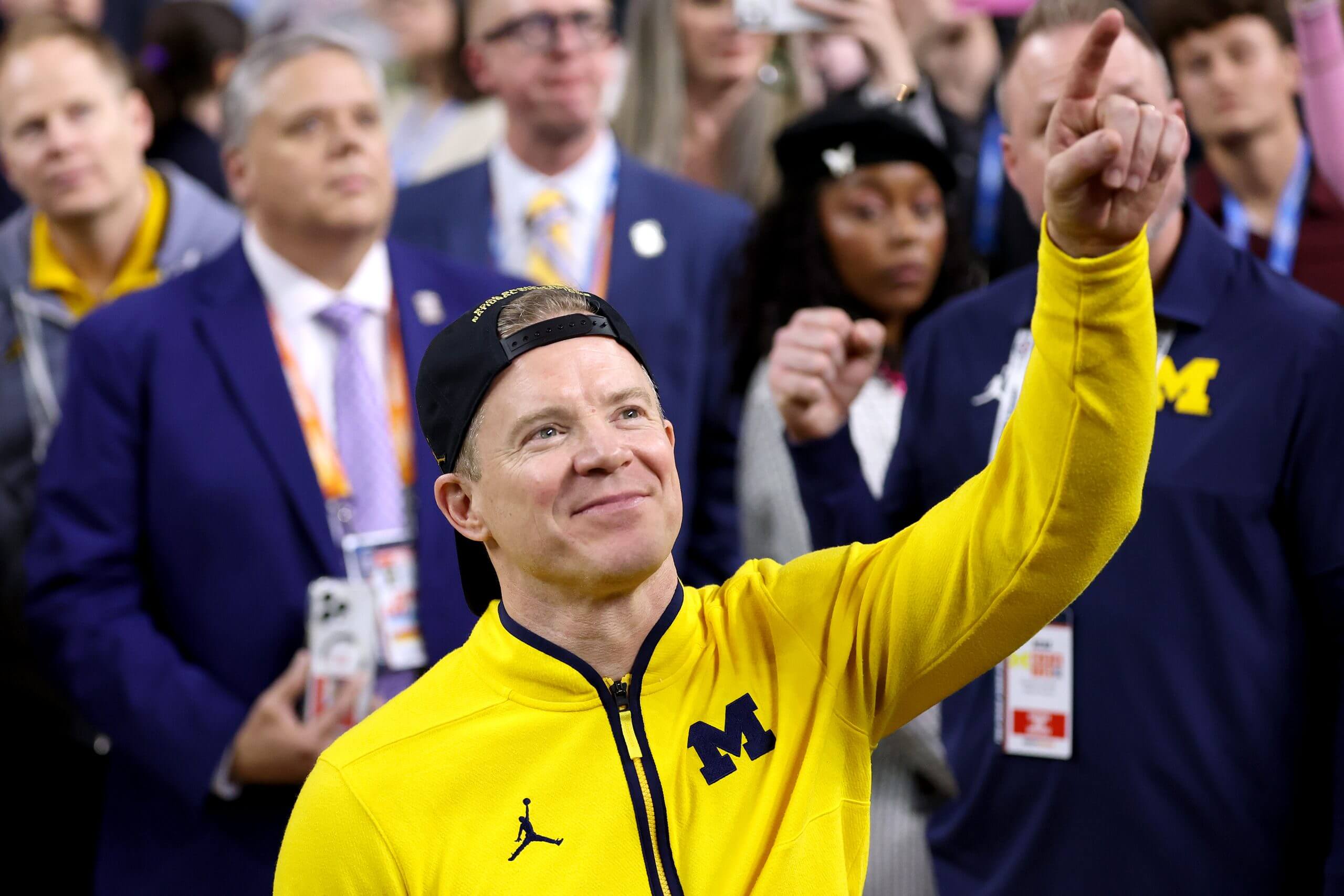 Michigan coach Dusty May watches "One Shinning Moment" after the Wolverines defeated UConn on Monday night to win the national championship. (Michael Reaves / Getty Images)