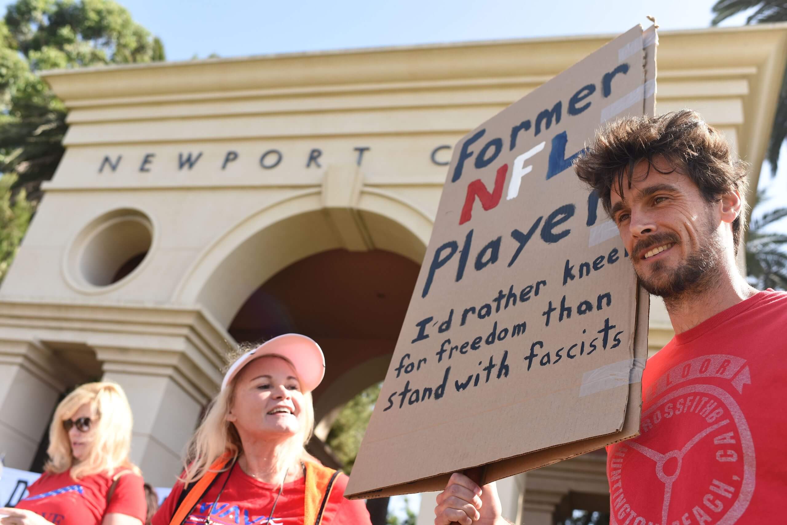 Chris Kluwe joins a small group of protestors outside the Pelican Hill Country Club in 2017. 