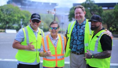 From left, Hawaii football coach Timmy Chang, Stanford Carr Development President Stanford Carr, interim stadium manager Michael Yadao and UH football associate head coach Chris Brown posed moments after an upper section of Aloha Stadium, in background, was torn down with a "rollover" maneuver on Thursday.
