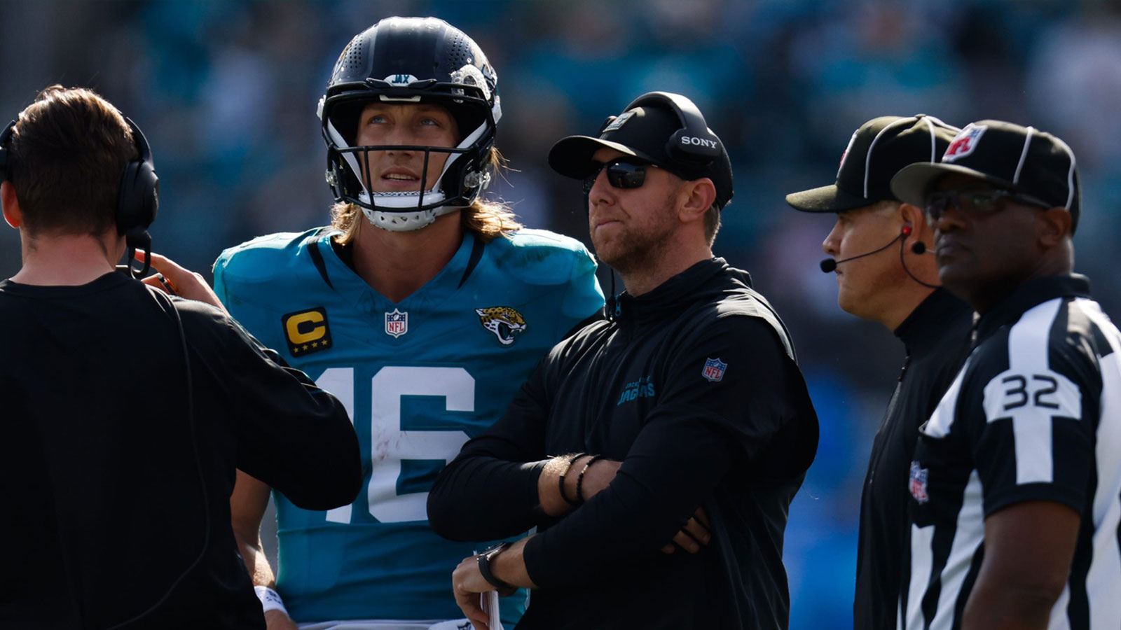 Jacksonville Jaguars quarterback Trevor Lawrence (16) and Jacksonville Jaguars head coach Liam Coen wait to see the result of a challenge during the second quarter in an NFL football AFC Wild Card playoff matchup, Sunday, Jan. 11, 2026, in Jacksonville, Fla. Bills lead 10-7 at the half over the Jaguars.