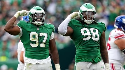 Moro Ojomo #97 and Jalen Carter #98 of the Philadelphia Eagles celebrate after a sack against the New York Giants (Getty Images via AFP)