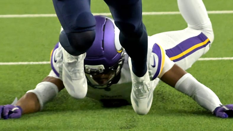 Ladd McConkey scores a touchdown against Jeff Okudah during a game. vikings players in limbo 2026