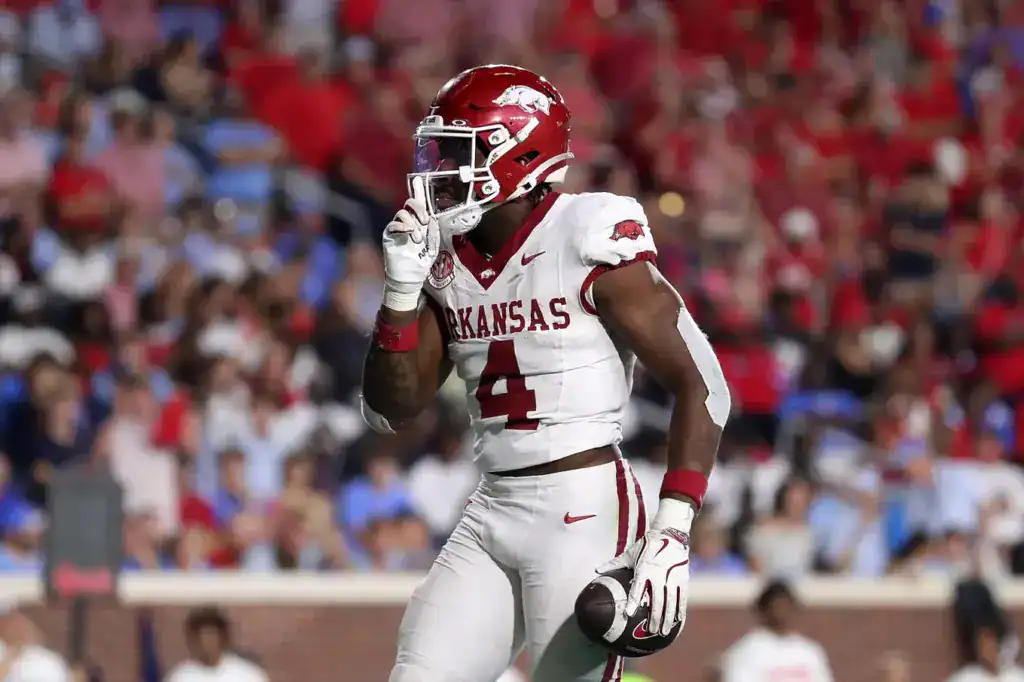 Dallas Cowboys Mock Draft prospect Arkansas running back holds the football after a big play