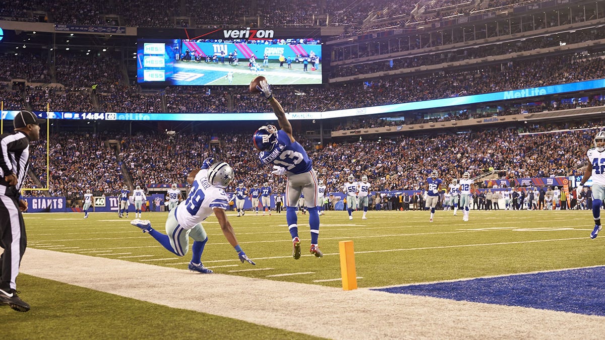 New York Giants Odell Beckham Jr. leaping to catch football at MetLife Stadium