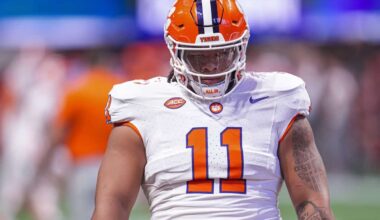 Dallas Cowboys Mock Draft target Peter Woods in Clemson white uniform before kickoff