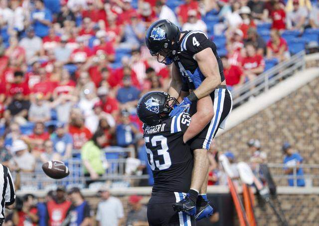 Duke’s Brian Parker II and Anderson Castle celebrate following a touchdown during the Blue Devils’ game against N.C. State on Sept. 20, 2025, at Wallace Wade Stadium in Durham.