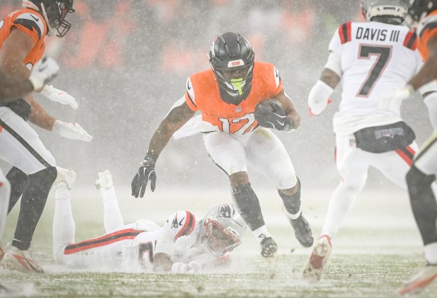RJ Harvey (12) of the Denver Broncos rushes the ball against the New England Patriots during the fourth quarter of the Patriots' 10-7 AFC Championship Game win at Empower Field at Mile High in Denver, Colorado on Sunday, Jan. 25, 2026. (Photo by AAron Ontiveroz/The Denver Post)