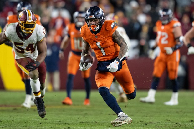 Tight end Evan Engram (1) of the Denver Broncos runs after a the catch against the Washington Commanders on Sunday, Nov. 30, 2025, at Northwest Stadium in Landover, MD. (Photo by Timothy Hurst/The Denver Post)