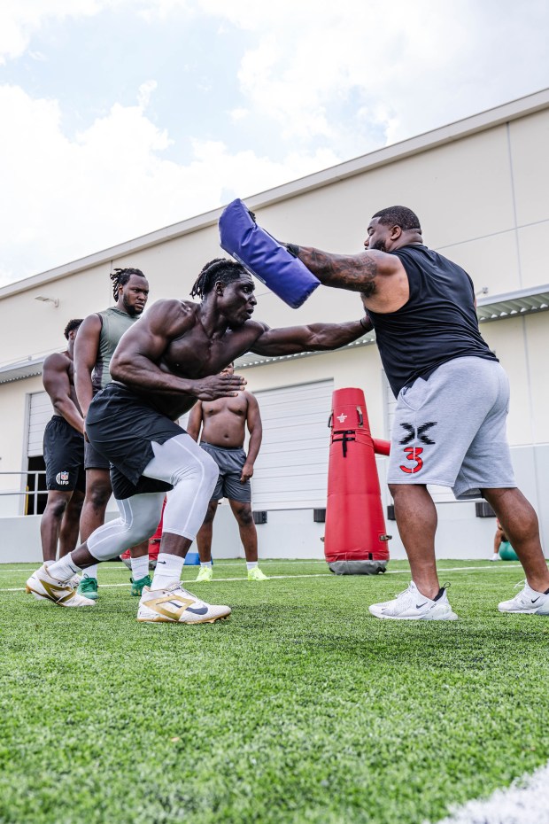 Viral Nigerian prospect Uar Bernard, left, training along with other members of the NFL's International Pathway Program circuit. (Courtesy photo)