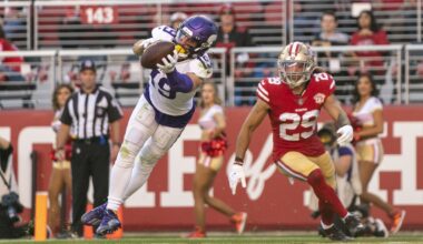 November 28, 2021; Santa Clara, California, USA; Minnesota Vikings wide receiver Adam Thielen (19) catches a touchdown against San Francisco 49ers safety Talanoa Hufanga (29) during the second quarter at Levi's Stadium.