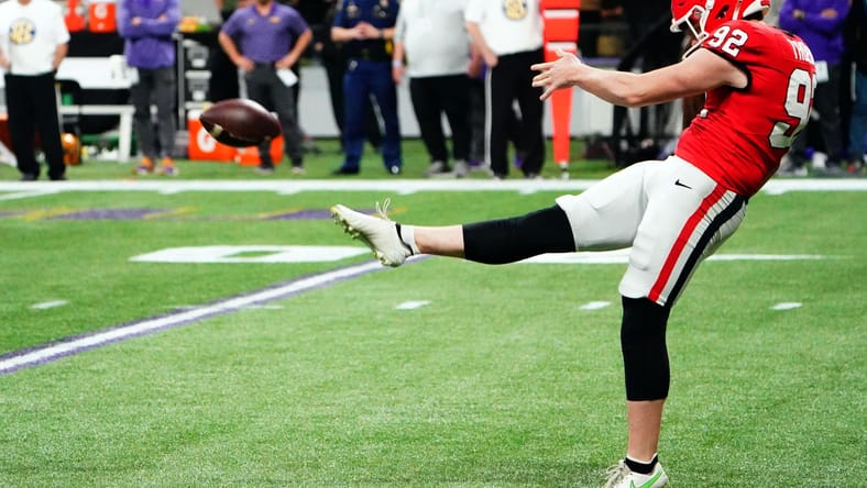 Brett Thorson punts during the SEC Championship game in Atlanta. Brett Thorson Vikings