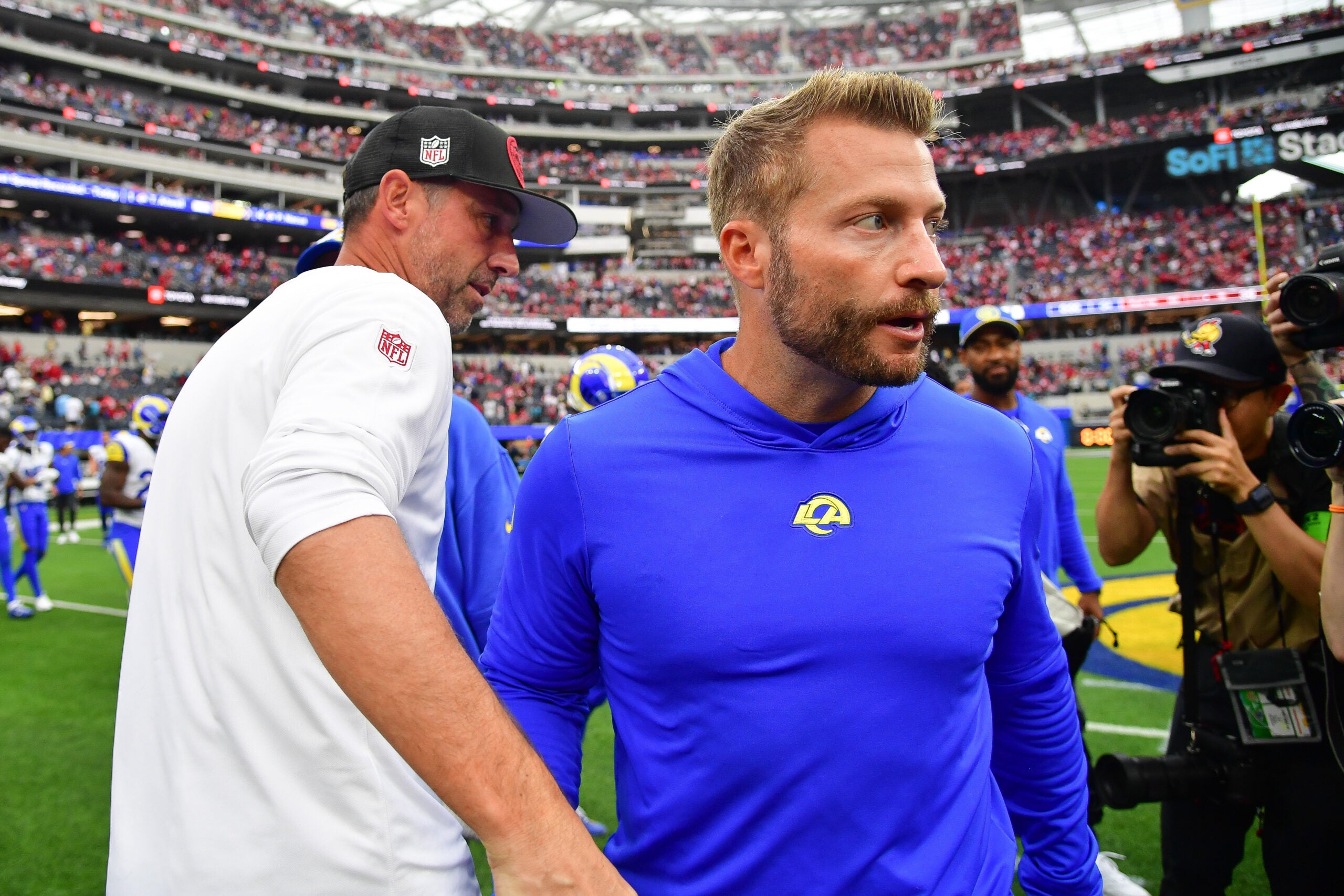Sep 17, 2023; Inglewood, California, USA; San Francisco 49ers head coach Kyle Shanahan meets with Los Angeles Rams head coach Sean McVay following the victory at SoFi Stadium.
