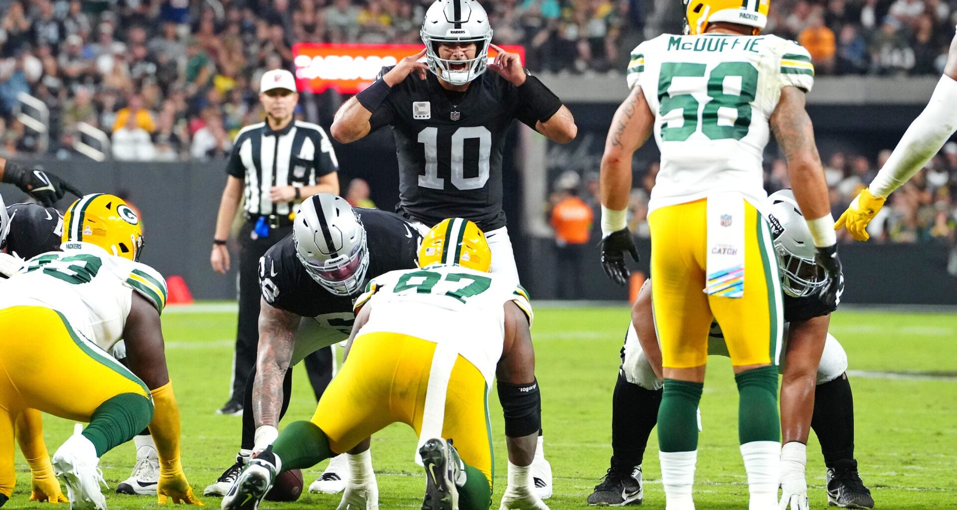 Oct 9, 2023; Paradise, Nevada, USA; Las Vegas Raiders quarterback Jimmy Garoppolo (10) calls a play against the Green Bay Packers during the second quarter at Allegiant Stadium.
