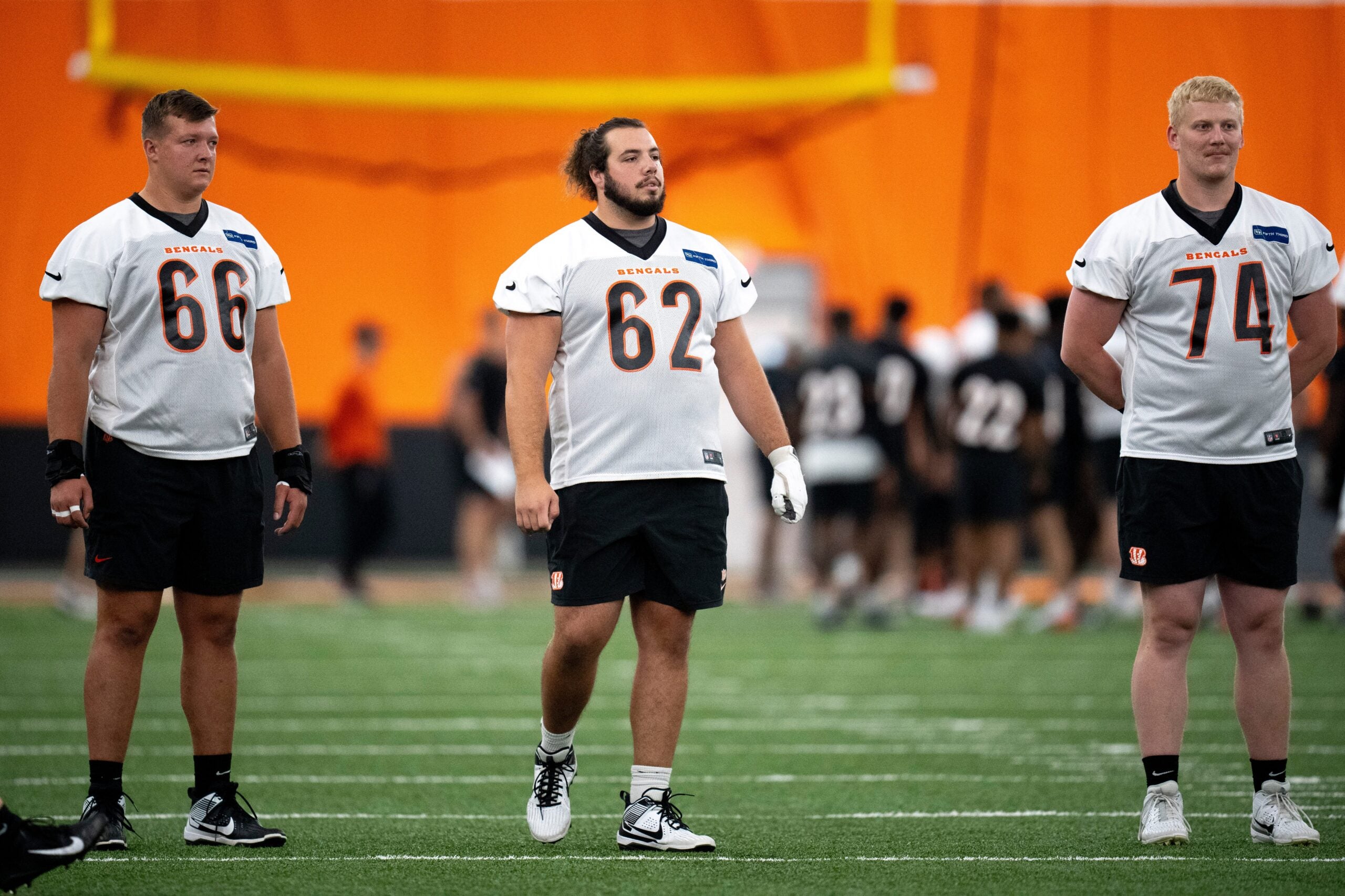 Cincinnati Bengals center Nate Gilliam (66), Cincinnati Bengals center Matt Lee (62) and Cincinnati Bengals offensive tackle Eric Miller (74) look on at Bengals spring practice at the IEL Indoor Facility in Cincinnati on Thursday, June 13, 2024.