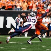 Cincinnati Bengals tight end Tanner Hudson (87) makes a catch as New England Patriots safety Kyle Dugger (23) puts on the pressure, Hudson dropped the ball and Patriots Marcus Jones recovered the ball in the 2nd quarter at Paycor Stadium Sunday, September 8, 2024.