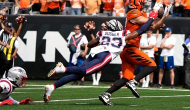 Cincinnati Bengals tight end Tanner Hudson (87) makes a catch as New England Patriots safety Kyle Dugger (23) puts on the pressure, Hudson dropped the ball and Patriots Marcus Jones recovered the ball in the 2nd quarter at Paycor Stadium Sunday, September 8, 2024.