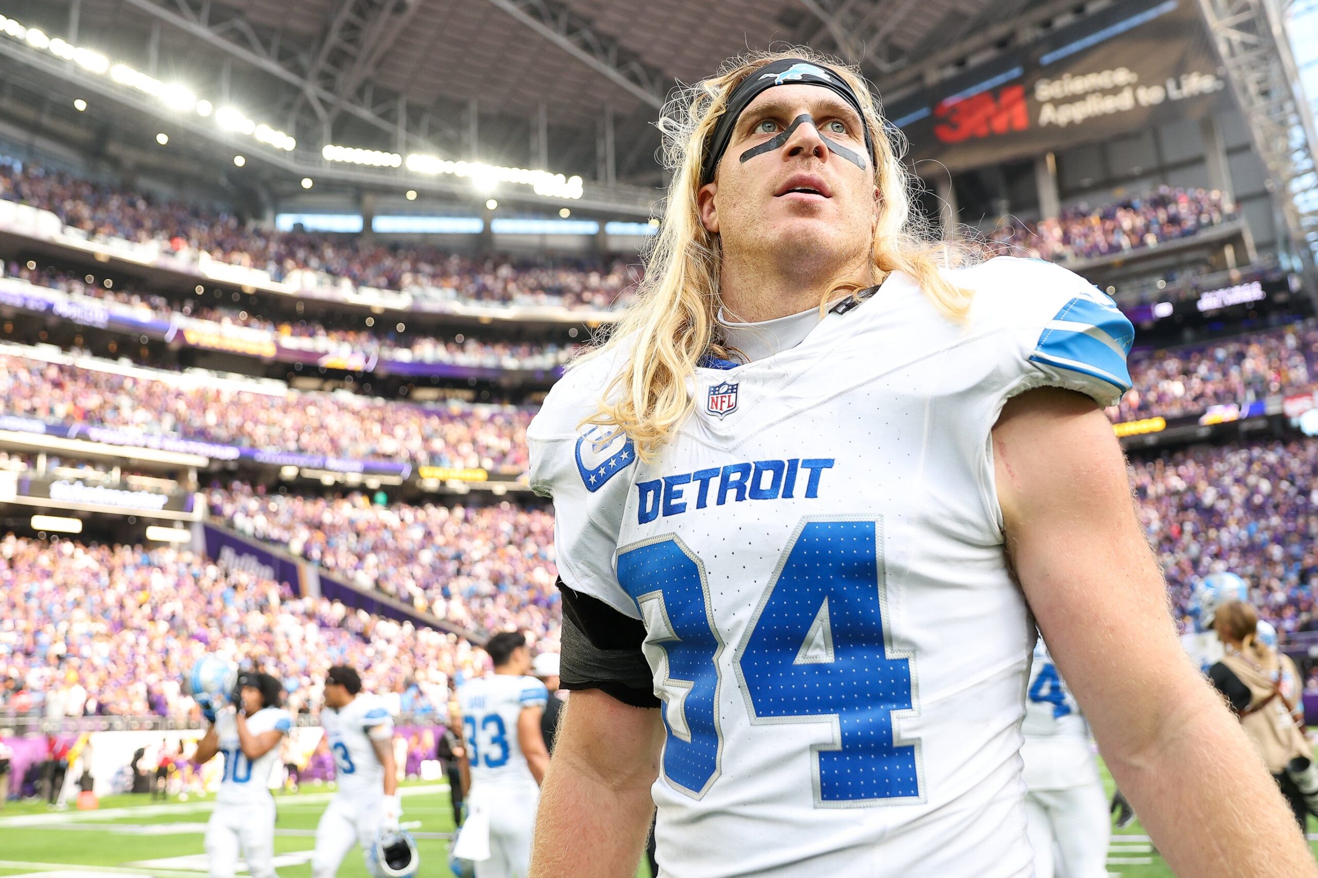 Oct 20, 2024; Minneapolis, Minnesota, USA; Detroit Lions linebacker Alex Anzalone (34) walks on the field after his teams win against the Minnesota Vikings at U.S. Bank Stadium.