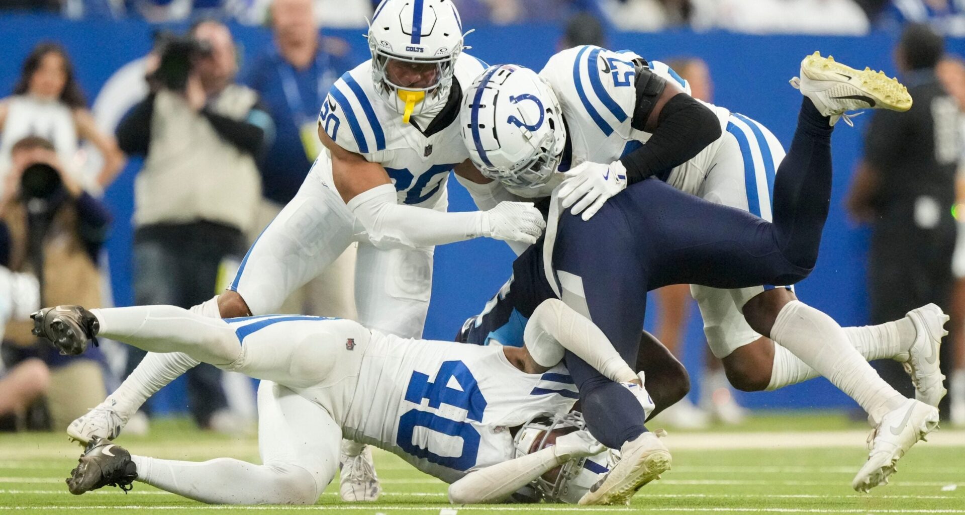 Colts LB Jaylon Carlies, CB Jayon Jones and former safety Nick Cross combine for a tackle