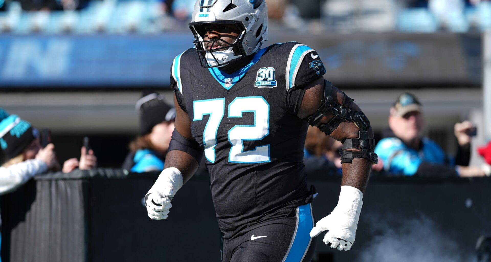 Dec 22, 2024; Charlotte, North Carolina, USA; Carolina Panthers offensive tackle Taylor Moton (72) takes the field during the first quarter against the Arizona Cardinals at Bank of America Stadium.