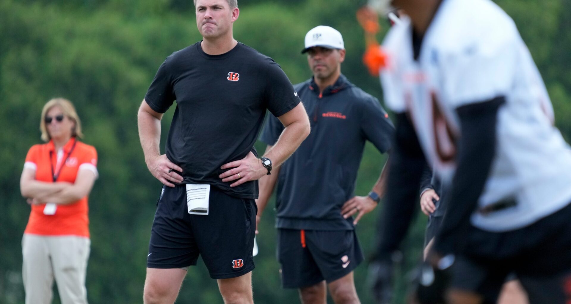 Cincinnati Bengals head coach Zac Taylor watches during a session of organized team activities on the Bengals practice field at Paycor Stadium in downtown Cincinnati on Tuesday, June 3, 2025.