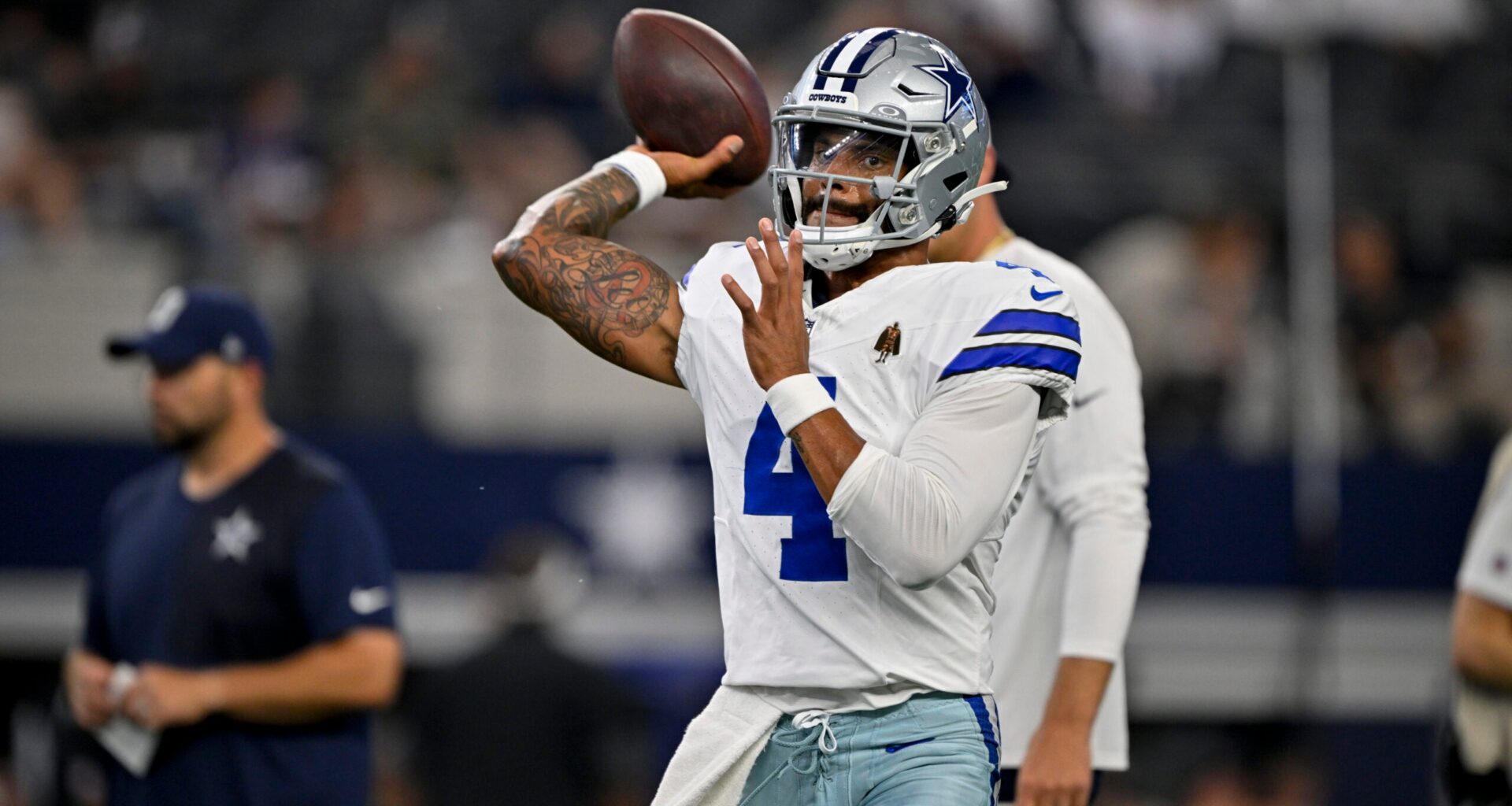 Aug 16, 2025; Arlington, Texas, USA; Dallas Cowboys quarterback Dak Prescott (4) warms up before the game at against the Baltimore Ravens AT&T Stadium.