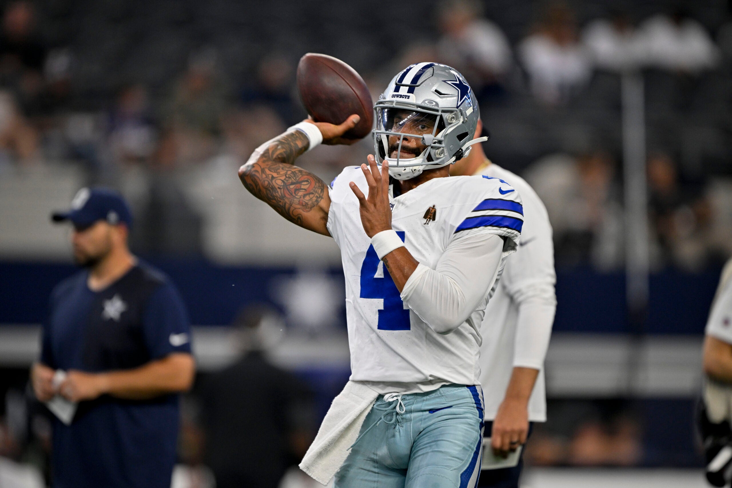 Aug 16, 2025; Arlington, Texas, USA; Dallas Cowboys quarterback Dak Prescott (4) warms up before the game at against the Baltimore Ravens AT&T Stadium.
