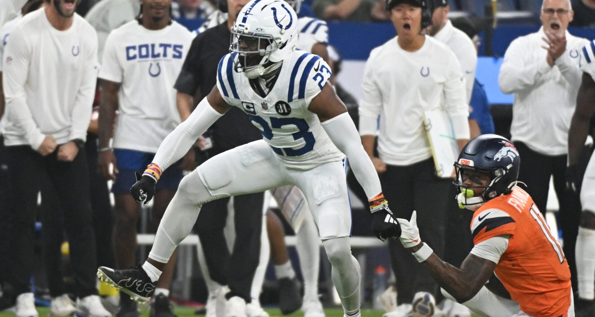 Sep 14, 2025; Indianapolis, Indiana, USA; Indianapolis Colts cornerback Kenny Moore II (23) celebrates tackling Denver Broncos wide receiver Troy Franklin (11) during the second quarter at Lucas Oil Stadium.