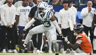 Sep 14, 2025; Indianapolis, Indiana, USA; Indianapolis Colts cornerback Kenny Moore II (23) celebrates tackling Denver Broncos wide receiver Troy Franklin (11) during the second quarter at Lucas Oil Stadium.