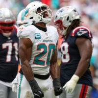Sep 14, 2025; Miami Gardens, Florida, USA; Miami Dolphins linebacker Jordyn Brooks (20) reacts after play against the New England Patriots in the fourth quarter at Hard Rock Stadium.