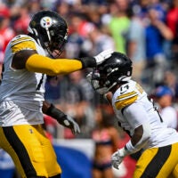 Sep 21, 2025; Foxborough, Massachusetts, USA; Pittsburgh Steelers running back Kenneth Gainwell (14) and Pittsburgh Steelers offensive tackle Broderick Jones (77) react after a touchdown during the first quarter at Gillette Stadium.