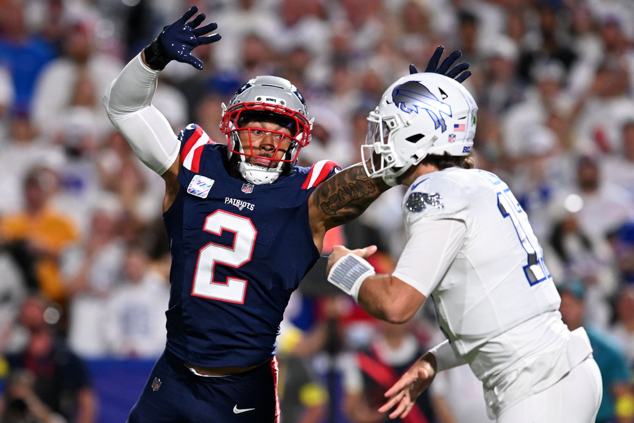 Oct 5, 2025; Orchard Park, New York, USA; New England Patriots linebacker Harold Landry III (2) pressures Buffalo Bills quarterback Josh Allen (17) during the first half at Highmark Stadium. Mandatory Credit: Mark Konezny-Imagn Images