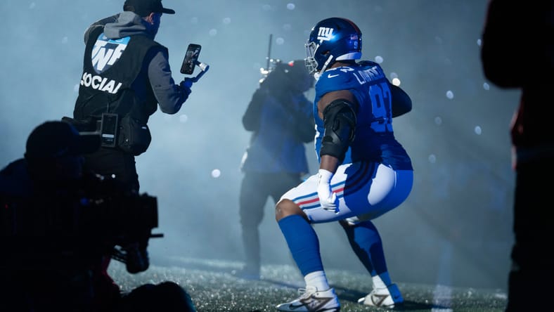 Dexter Lawrence runs out of the tunnel before a Thursday Night Football game