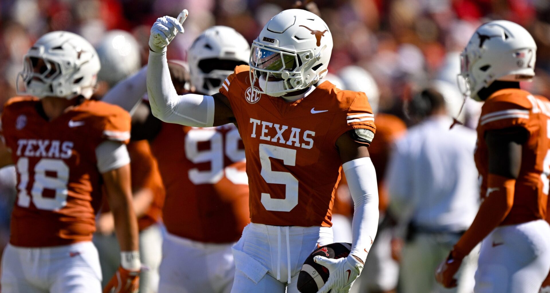 Oct 11, 2025; Dallas, Texas, USA; Texas Longhorns defensive back Malik Muhammad (5) celebrates after he intercepts a pass thrown by Oklahoma Sooners quarterback John Mateer (not pictured) during the first half at the Cotton Bowl.