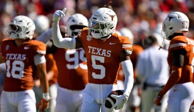 Oct 11, 2025; Dallas, Texas, USA; Texas Longhorns defensive back Malik Muhammad (5) celebrates after he intercepts a pass thrown by Oklahoma Sooners quarterback John Mateer (not pictured) during the first half at the Cotton Bowl.