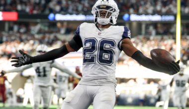 Oct 19, 2025; Arlington, Texas, USA; Dallas Cowboys cornerback Daron Bland (26) carries the ball after an interception for a touchdown against the Washington Commanders during the third quarter of the game at AT&T Stadium.
