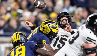 Michigan defensive end Derrick Moore (8) forces Purdue quarterback Ryan Browne (15) to fumble during the first half at Michigan Stadium in Ann Arbor on Saturday, November 1, 2025.