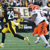 Nov 16, 2025; Pittsburgh, Pennsylvania, USA; Pittsburgh Steelers safety Kyle Dugger (29) intercepts the ball against the Cincinnati Bengals during the second half at Acrisure Stadium.