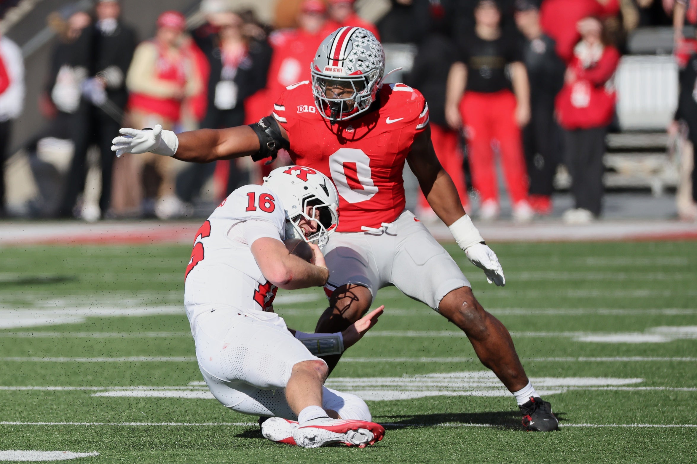 Nov 22, 2025; Columbus, Ohio, USA; Ohio State Buckeyes linebacker Sonny Styles (0) tackles Rutgers Scarlet Knights quarterback Athan Kaliakmanis (16) during the first quarter at Ohio Stadium. Mandatory Credit: Joseph Maiorana-Imagn Images