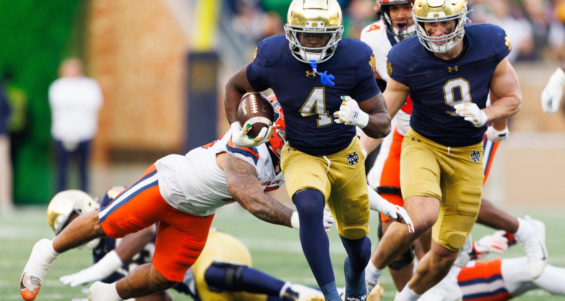 Notre Dame running back Jeremiyah Love (4) runs with the ball on his way to score a touchdown in the first half of a NCAA football game against Syracuse at Notre Dame Stadium on Saturday, Nov. 22, 2025, in South Bend.